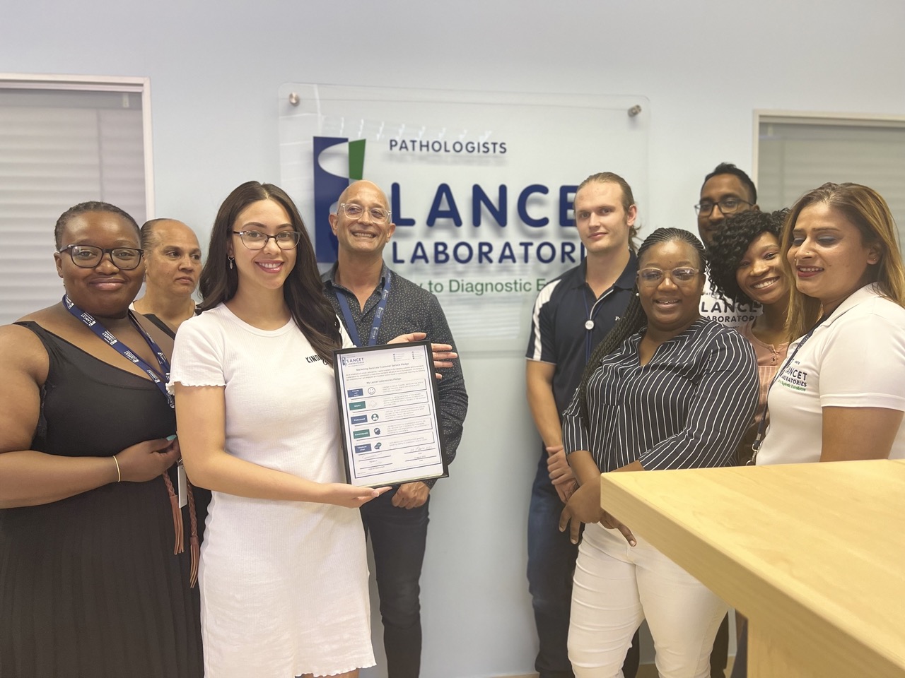 lancet labs staff with lanceteers pledge